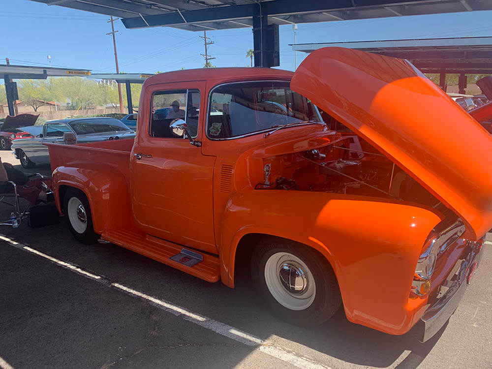 An orange truck at a Car Show at Downtown Campus