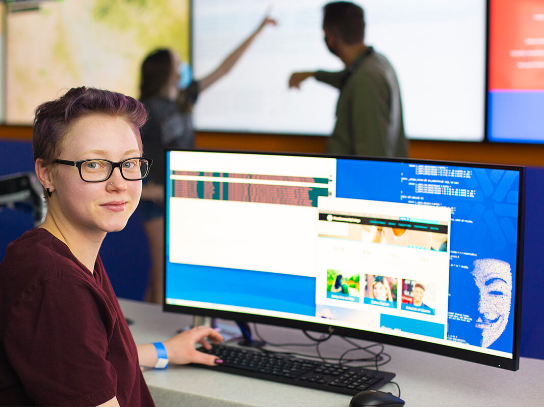 A student turns for a photo in the Fusion Center