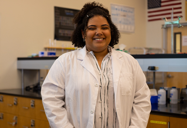 Ana Silva Pereira poses smiling in a Northwest Campus Lab