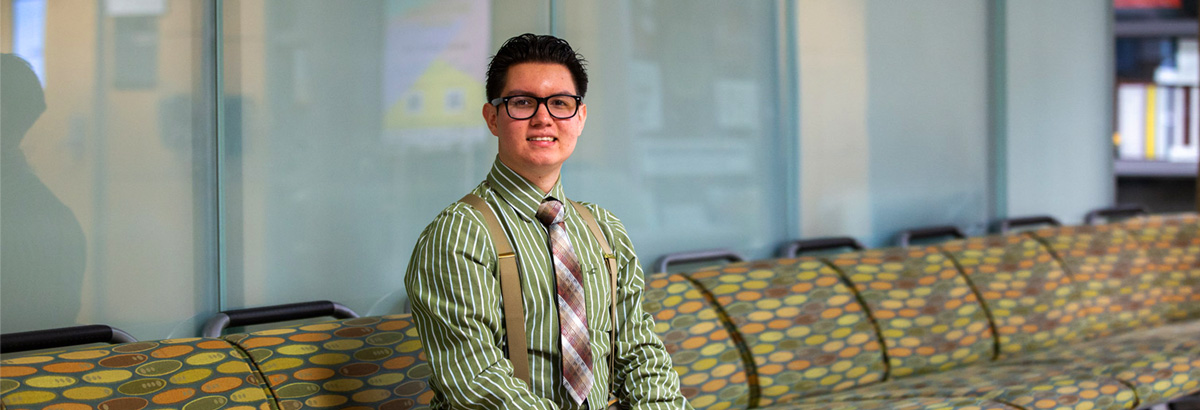 Nicolas Fimbres sits smiling at Pima West Campus