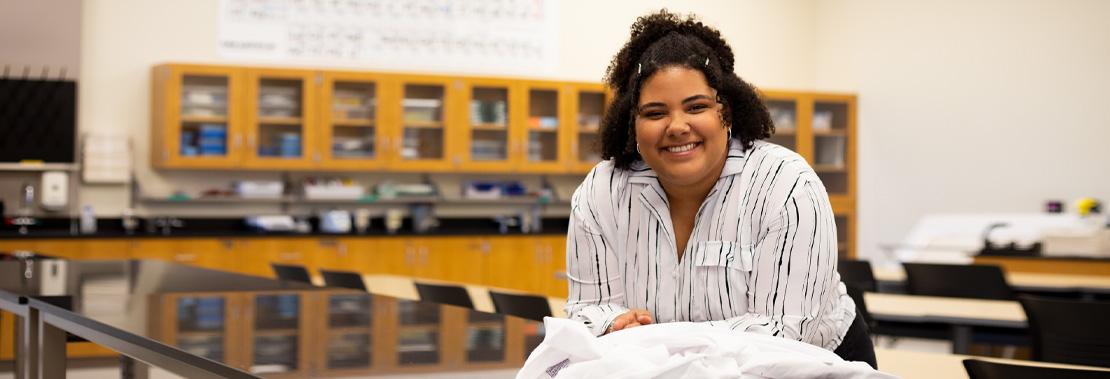 Ana Silva Pereira poses smiling in a Northwest Campus Lab