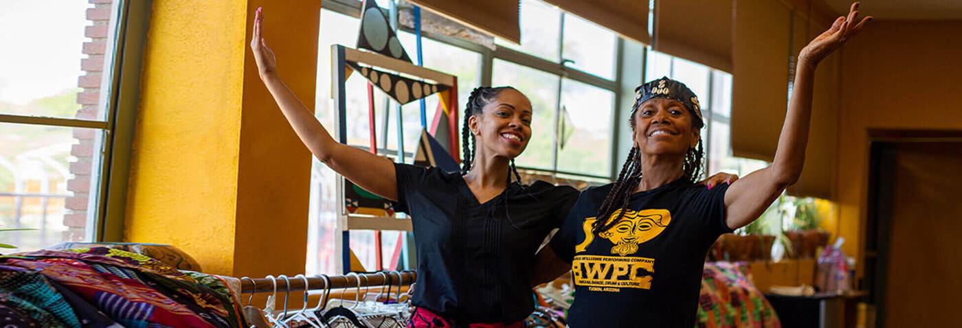 Barbea Williams and her daughter Bea pose for a photo in their dance studio