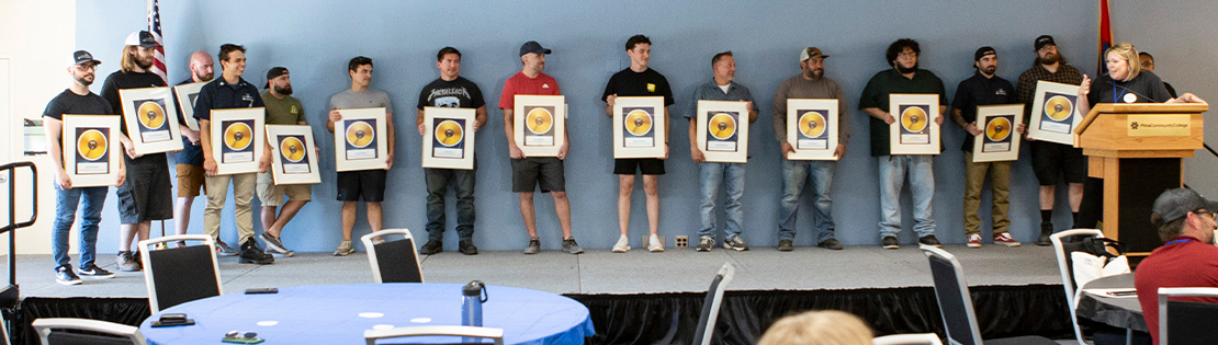 A group of Metallica Scholar's receive their award at a ceremony