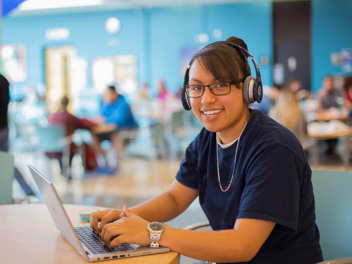 A student works on a laptop