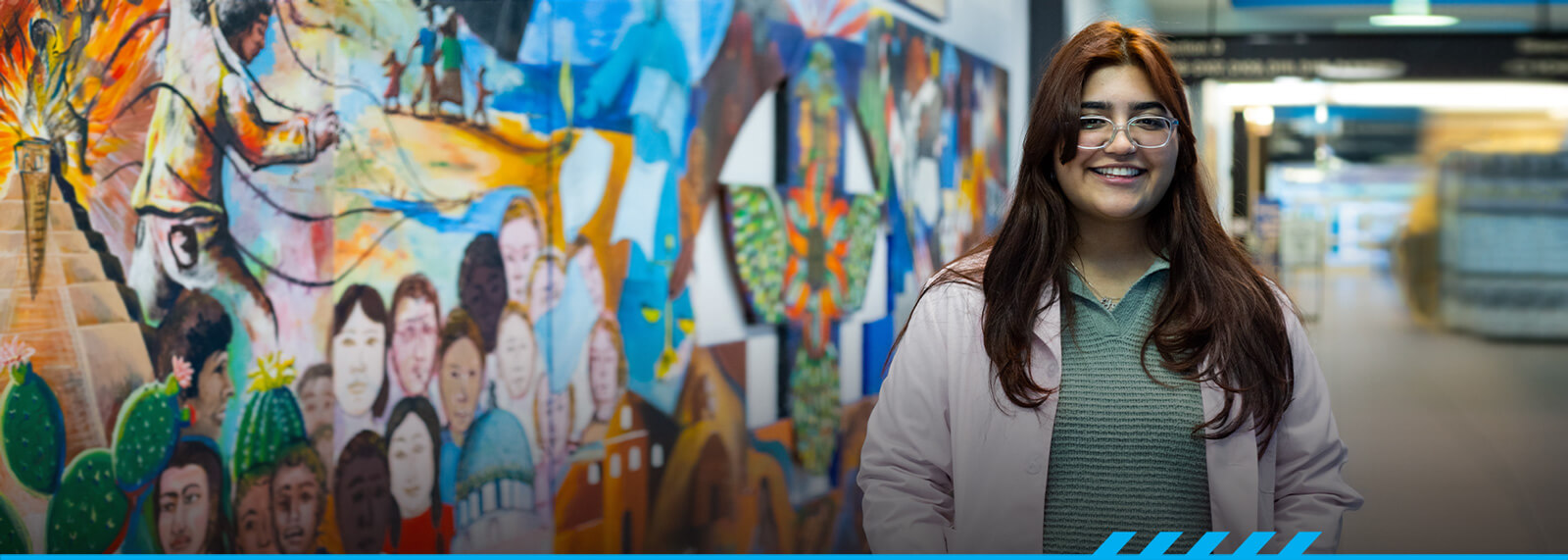 Marian Jimenez stand in the corridor at Desert Vista campus.