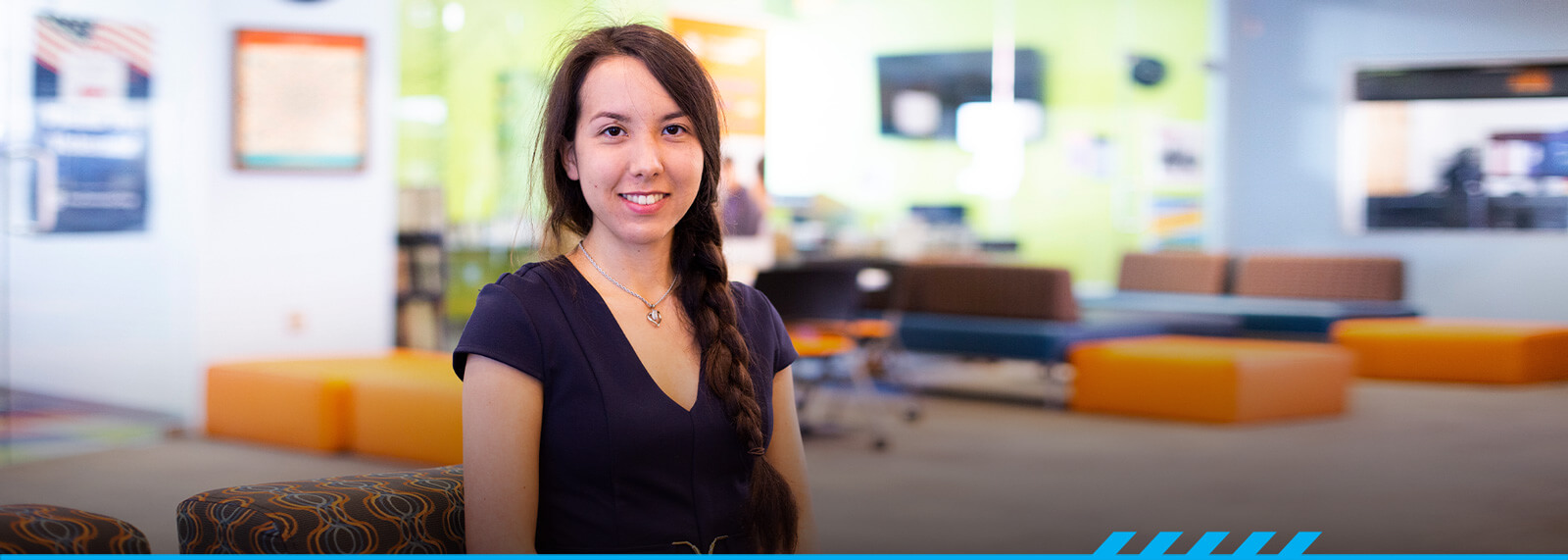 Kira Okuma poses looking at the camera at Pima's Northwest campus.