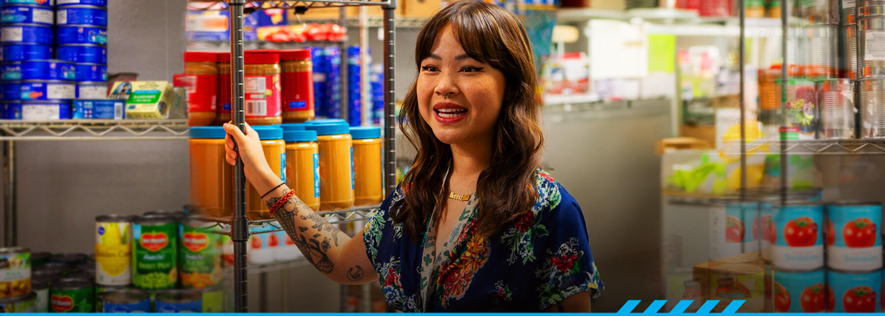 Susan Ho stands in the ARC Resource Center and Pantry.
