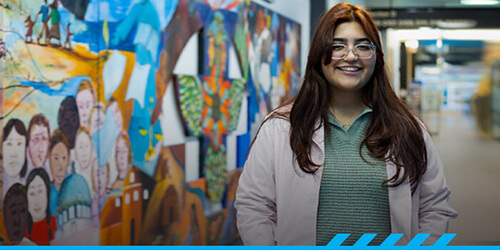 Marian Jimenez stand in the corridor at Desert Vista campus.