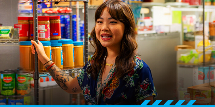 Susan Ho stands in the ARC Resource Center and Pantry.