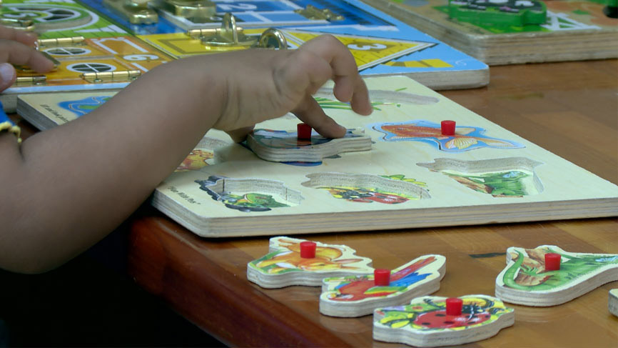 Child working on puzzle