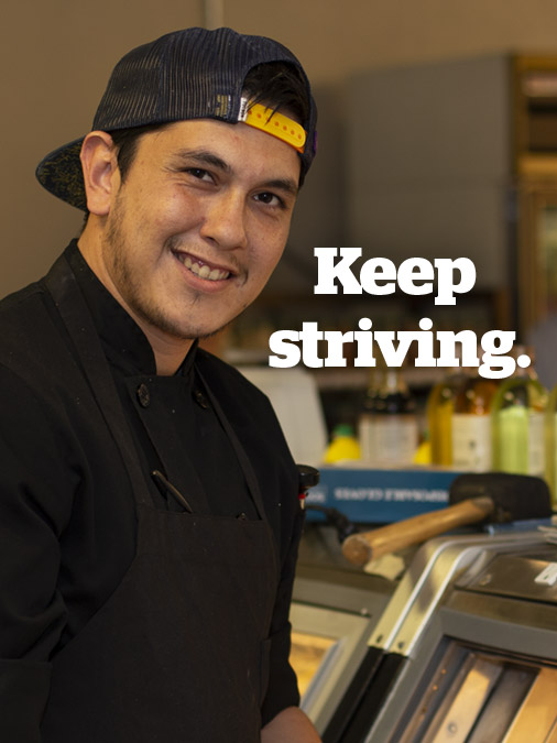 Pima culinary student working a deli