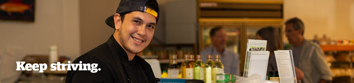 Pima culinary student working a deli