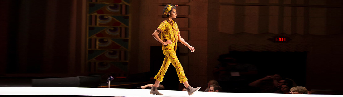 A Pima student walks the runway in a fashion show