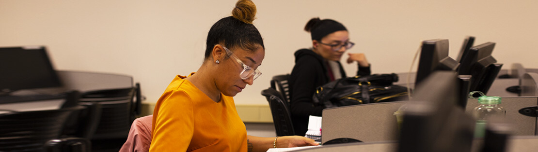 Two students study in a Pima classroom