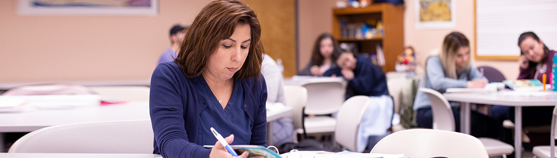 An adult learner studies at a Pima Adult Learning Center