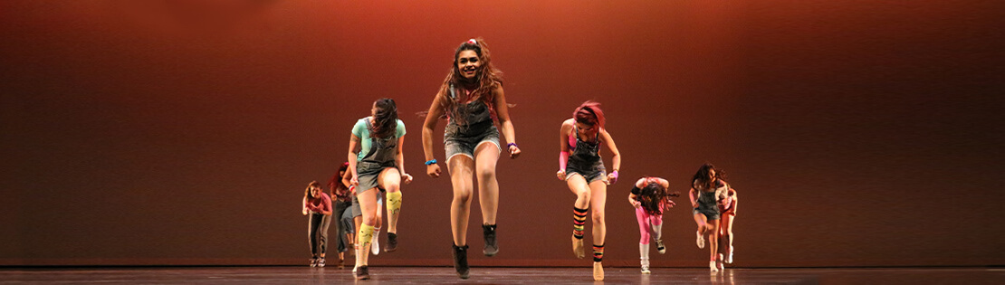 Dancers dancing on a Pima Stage