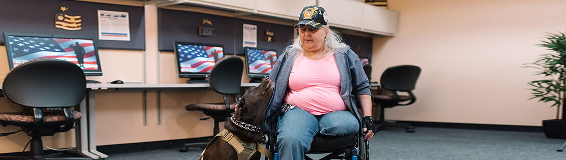 Veteran sits in a PCC Veterans Center with their service animal