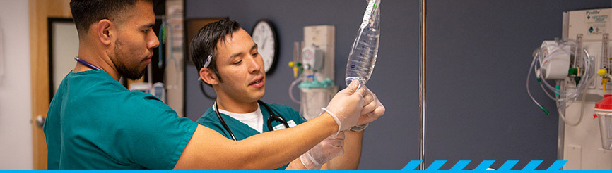 Two nursing students with IV bag