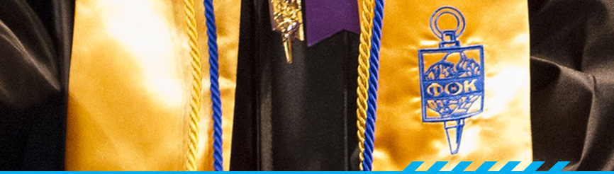 Graduate with Phi Theta Kappa banner