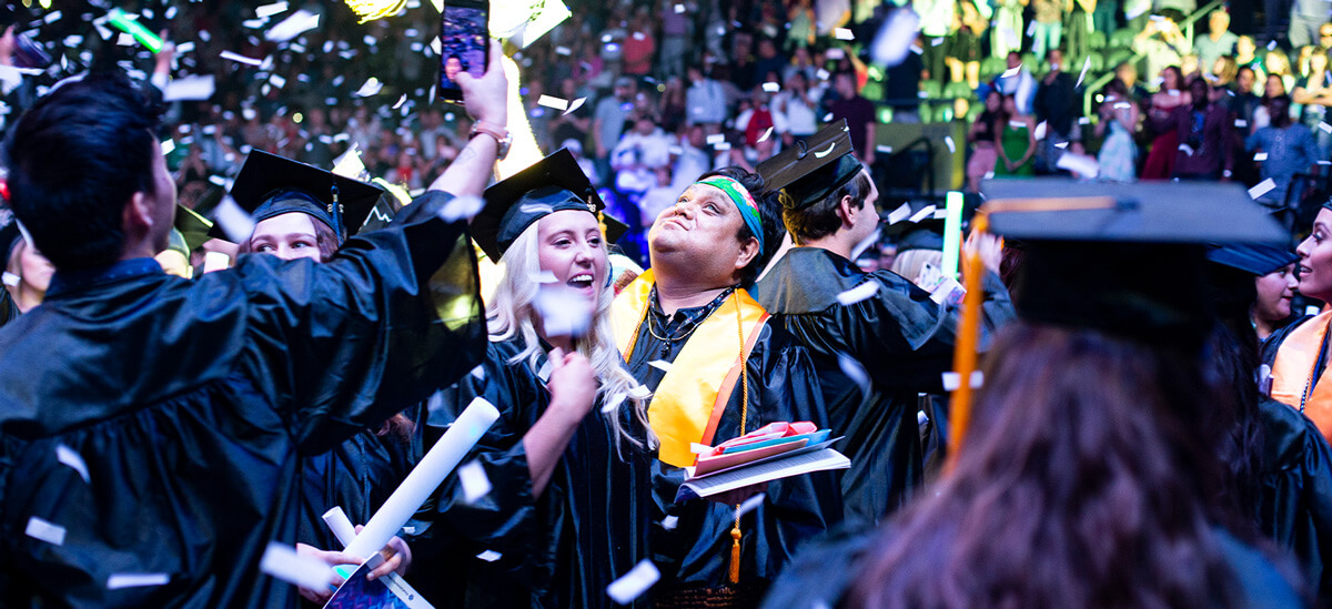 two people celebrate at a Pima graduation